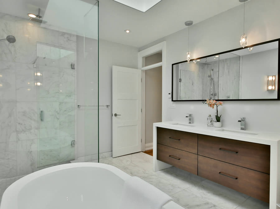 Lime Plaster Ensuite, marble tile with a walnut floating vanity