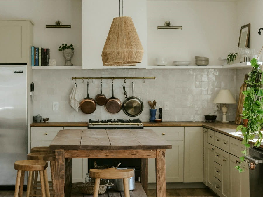 The Serving Pantry, open shelving, copper pans and a plaster wall
